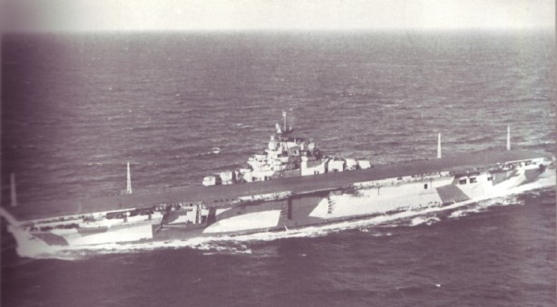 USS Hornet (CV-12) underway in January 1944 during her shakedown in the Atlantic, before Air Group 15 came aboard. She is wearing Measure 33, Design 3A camouflage. There are only four radio masts on the starboard side of the flight deck, and the hangar catapult outrigger is in the stowed position. In place of a third Mk 37 director, a 40-mm quad mount was fitted at the same level as the flight deck. Note the hull number on the flight deck is unusually painted facing "the other" way — this was corrected before she entered combat. http://www.navsource.org/archives/02/12.htm
